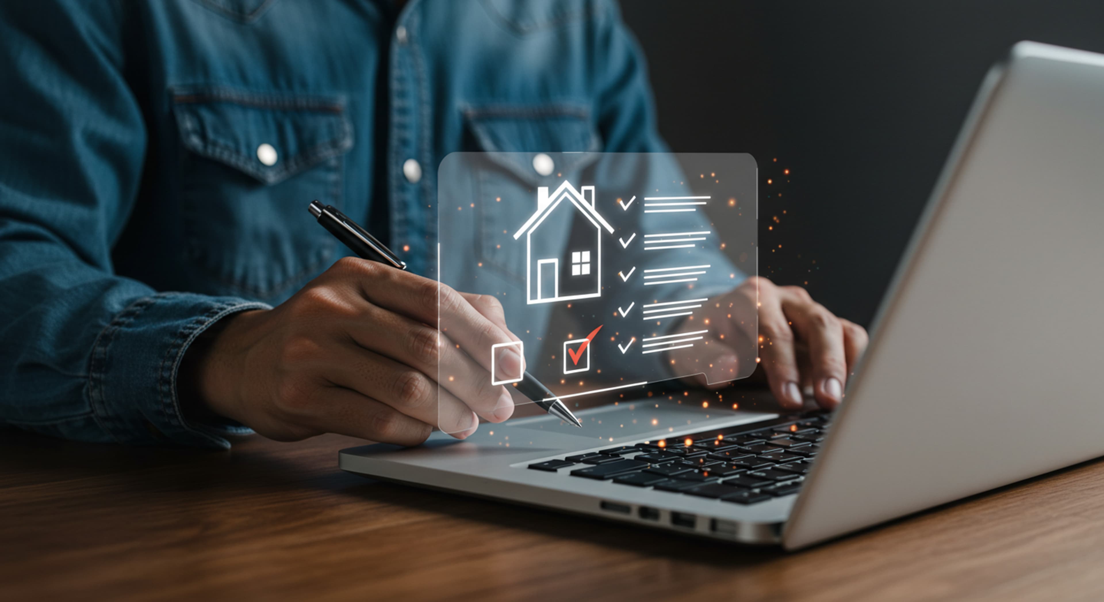 Inspector completing a digital home inspection checklist on a laptop